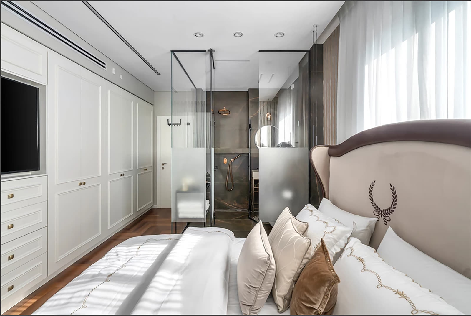 Classic white bedroom wardrobes with traditional detailing by iKitchen Cabinetry