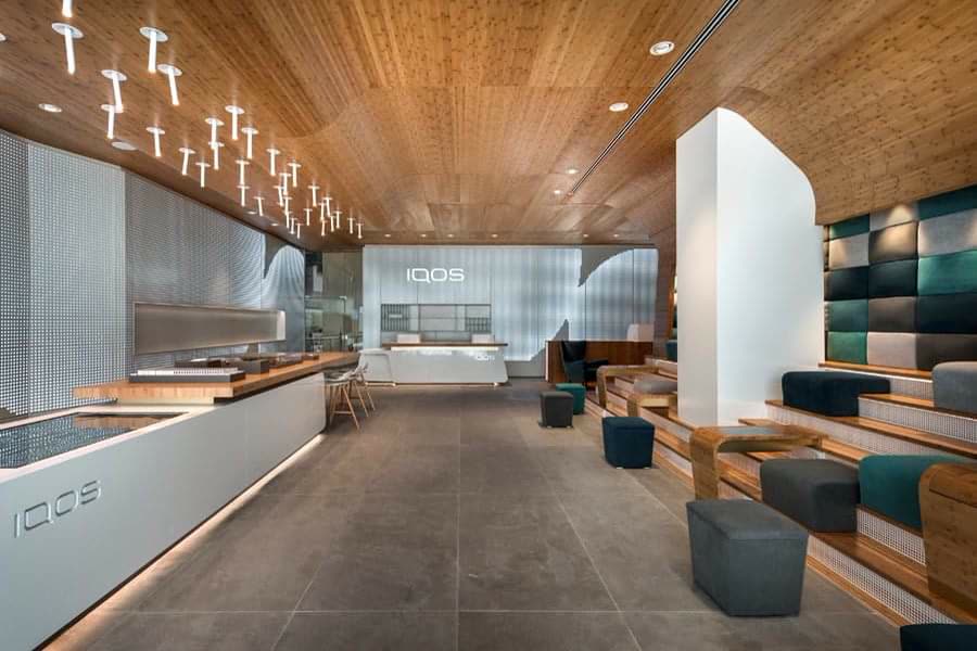 Custom commercial millwork with wood detailing and integrated seating in a hospitality interior
