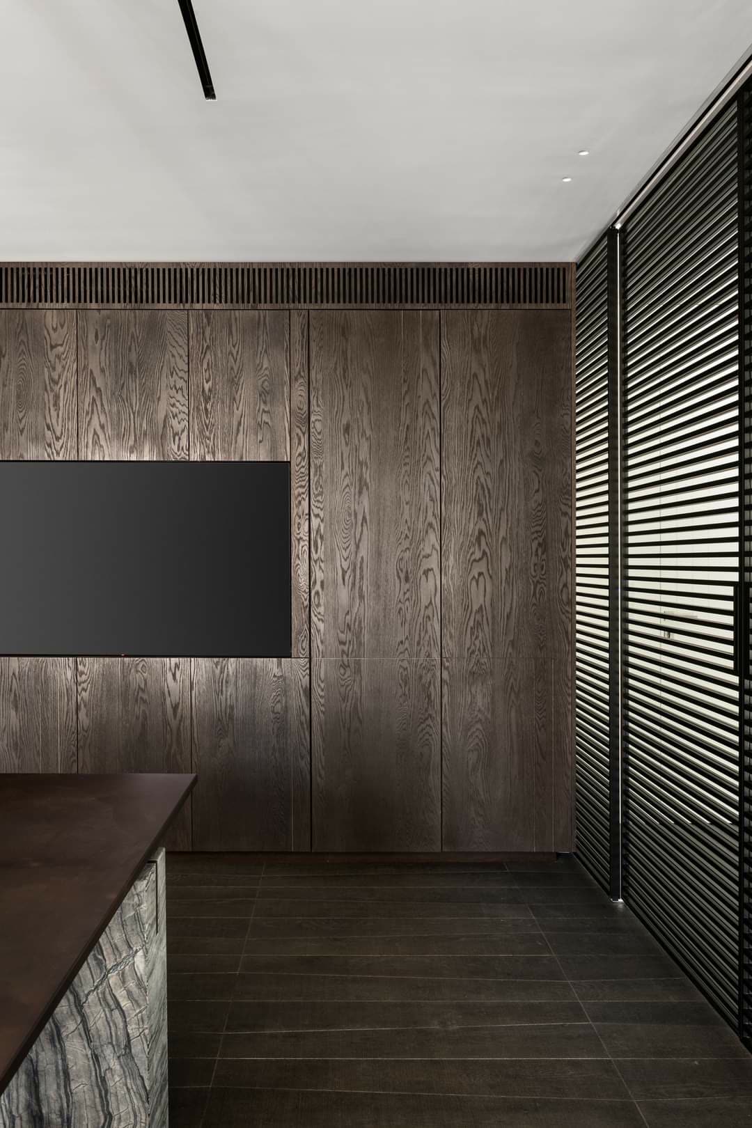 Smoked-oak full-height paneled dining room by iKitchen Cabinetry